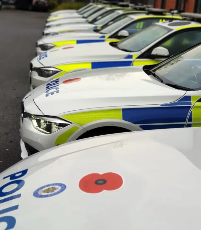 Police cars with poppy stickers