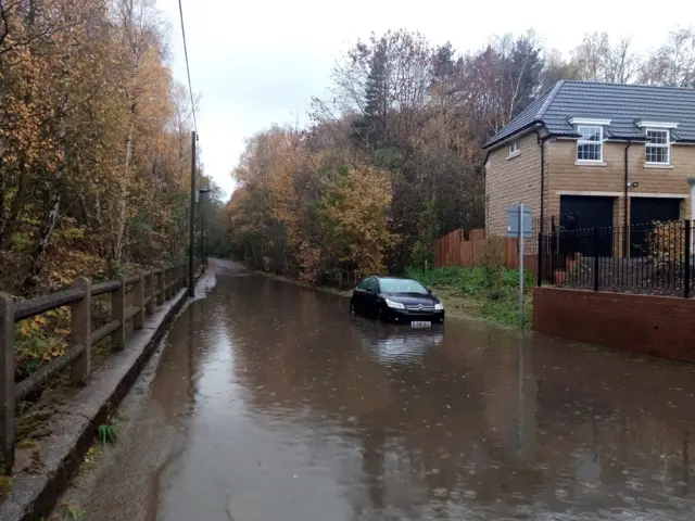 Car in flood water at New Road, Pilley, in Barnsley