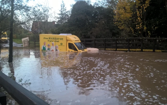 Morrisons van in flood water