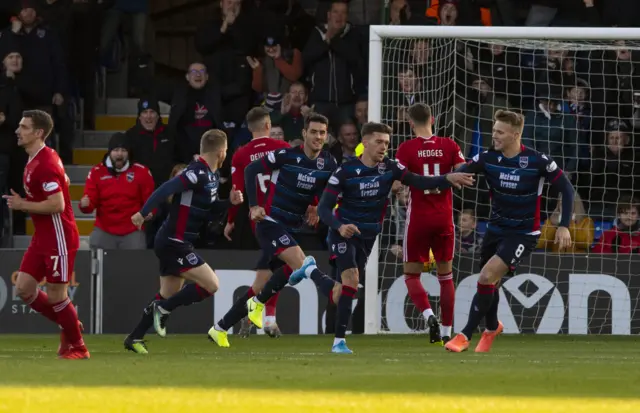 Ross County's Josh Mullin celebrates scoring his penalty to make it 1-0