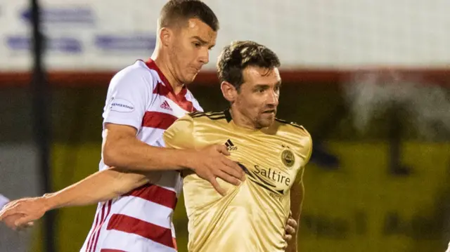 Craig Bryson (right) is back in the Aberdeen starting line-up