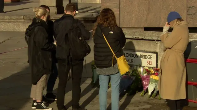 Mourners pay their respects close to the scene of the attack at London Bridge