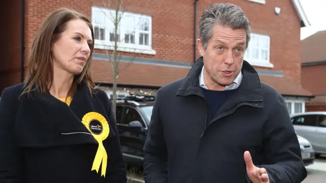 Hugh Grant with Lib Dem candidate Monica Harding