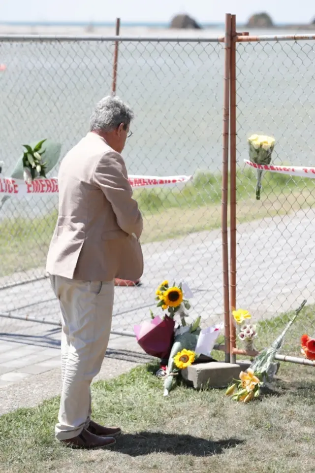Man leaving flowers