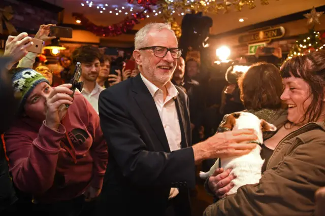 Britain"s main opposition Labour party leader Jeremy Corbyn (C) meets supporters during a campaign event in Carlisle, north-west England