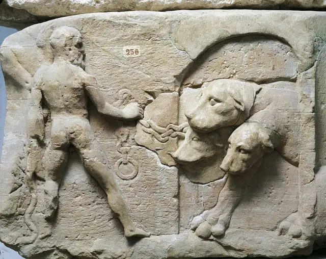 A Roman relief depicts Hercules taming Cerberus, the three-headed beast that guards the gates of Hades, the mythological underworld