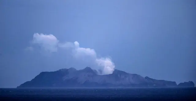 Smoke and ash rises from a volcano on White Island