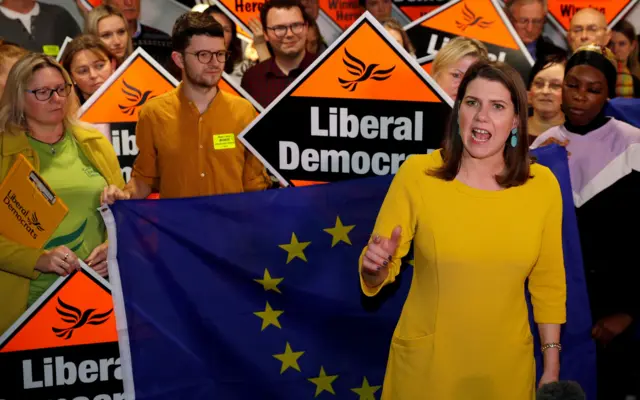 Liberal Democrat supporters hold EU flags as part leader Jo Swinson (C) gives a speech during a general election campaign rally in Bath, south west England on December 10, 2019