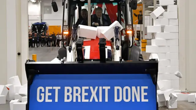 Boris Johnson driving a JCB