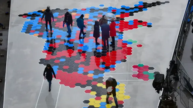 BBC staff lay out tiles for map of UK