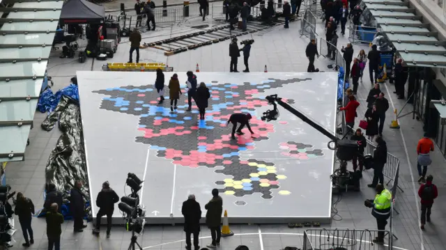 BBC staff lay out tiles for map of UK