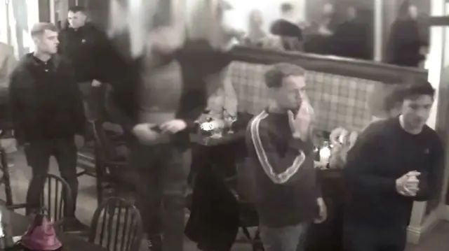 CCTV images of men in pub