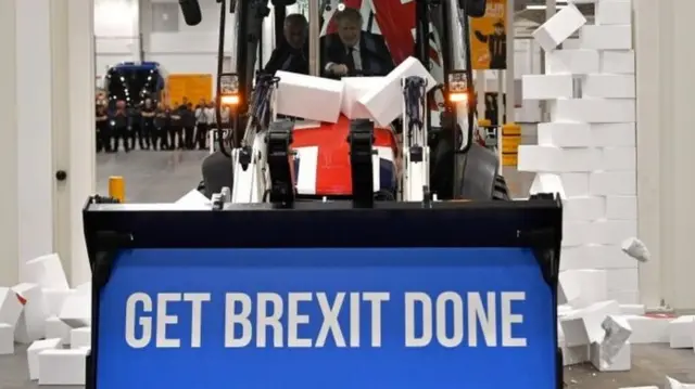 Boris Johnson driving "Get Brexit Done" JCB