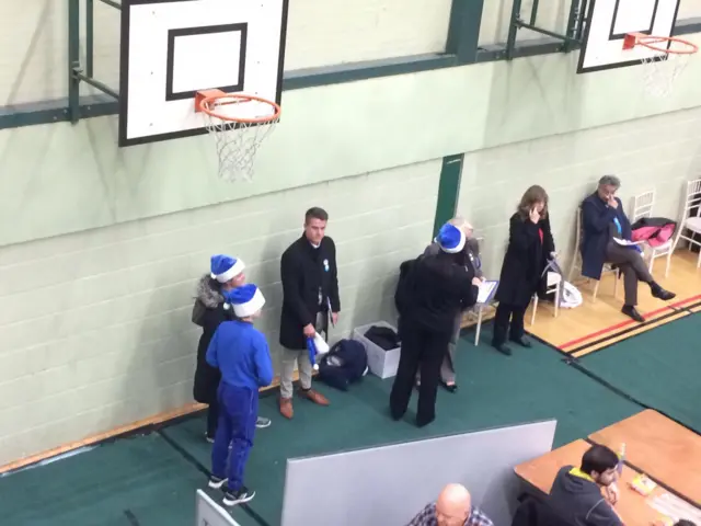 Conservative supporters in blue Santa hats