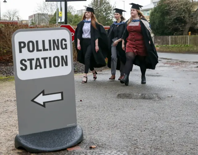 Students from the University of Reading arrive to vote in the General Election 2019 on graduation day.