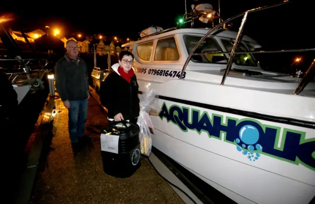 Northern Ireland's only off-shore ballot box arrives into Ballycastle Harbour from Rathlin Island on a private charter on Thursday night.