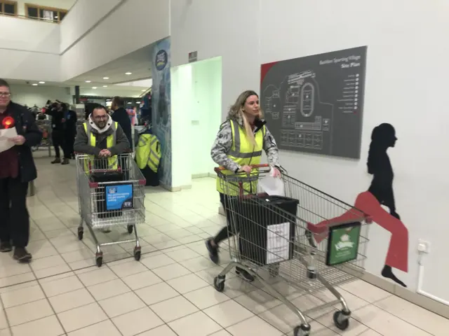 Trolleys bring ballot boxes to count