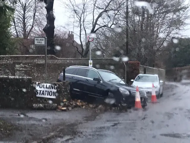 A car crashed through a wall outside a polling station in West Sussex
