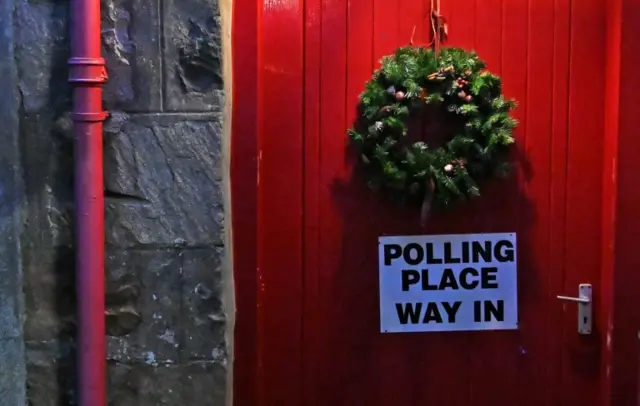 A Christmas wreath hangs on the door of a polling station in Furnace, near Inveraray