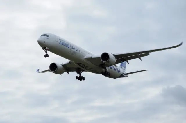 An Airbus A350-1000 conducts a test flight over Chateauroux airport, central France