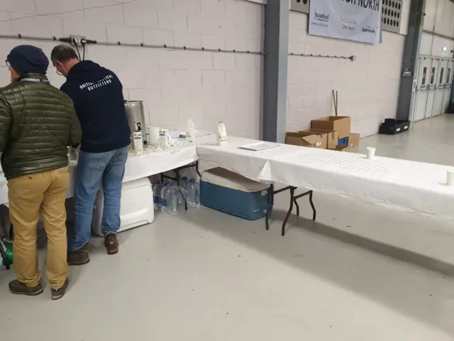 Men and empty table at Norwich North count