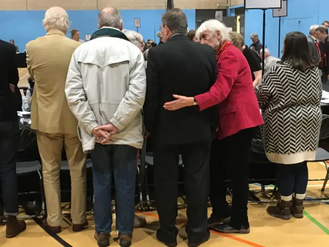 Count observers and labour campaigners, with supportive arm around David Drew