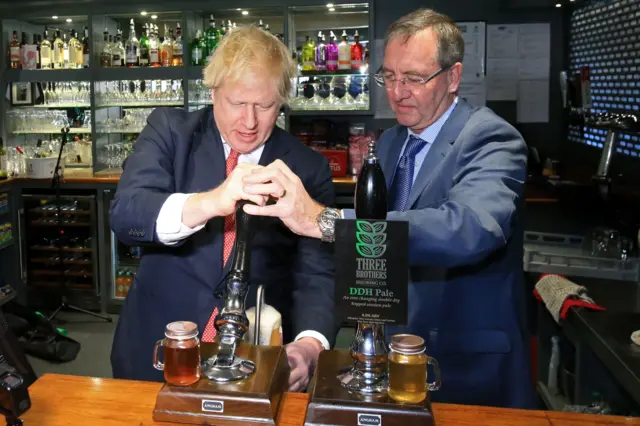 Boris Johnson pulls a pint with newly elected Conservative Party MP for Sedgefield, Paul Howell, at Sedgefield Cricket Club