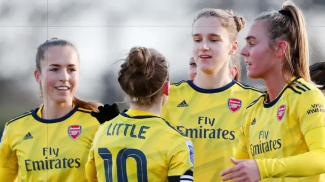 Arsenal celebrate their first goal against Everton