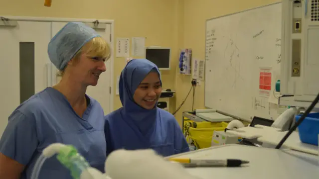 Junior doctor Farah Roslan (right) with consultant surgeon Gill Tierney