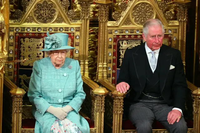 Queen Elizabeth II and the Prince of Wales sit in the chamber ahead of the State Opening of Parliament by the Queen, in the House of Lords at the Palace of Westminster