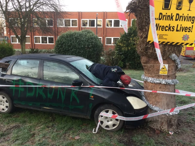 Staged scene of crashed car