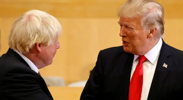 U.S. President Donald Trump greets British Foreign Secretary Boris Johnson (L) as they take part in a session on reforming the United Nations at U.N. Headquarters in New York, U.S