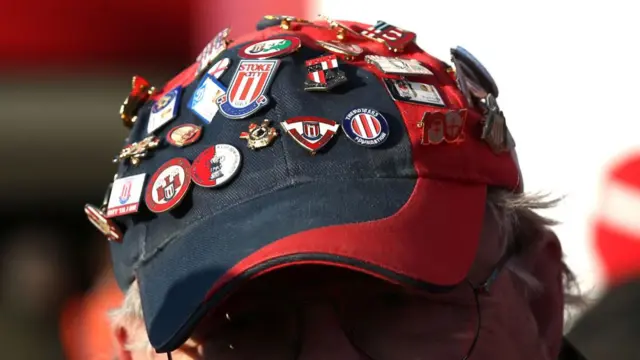 A fan with Stoke City themed cap