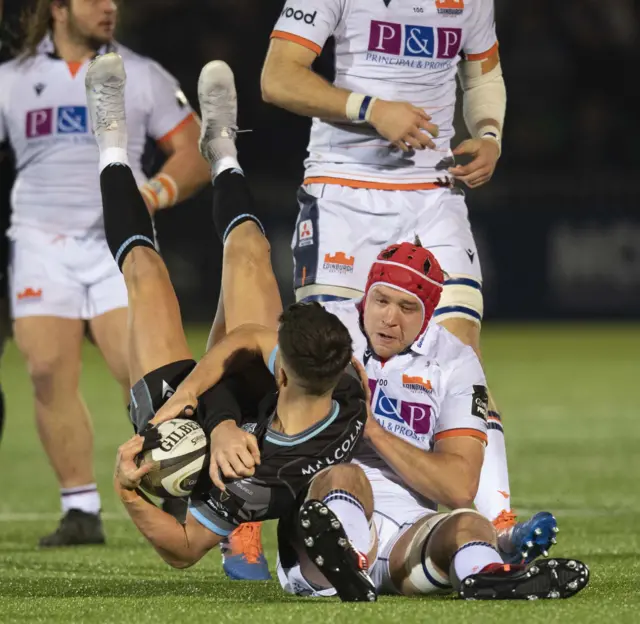 Adam Hastings is tackled by Grant Gilchrist