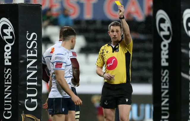 Tomos Williams receives a yellow card