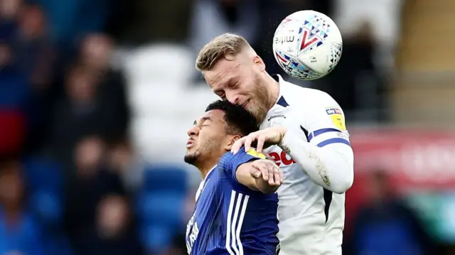 Nathaniel Mendez-Laing of Cardiff City and Tom Clarke of Preston North End