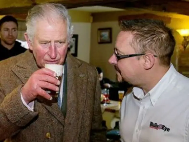 Prince Charles drinking in a pub