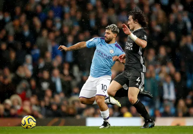 Manchester City"s Sergio Aguero (left) and Leicester City"s Caglar Soyuncu battle for the ball during the Premier League match at the Etihad Stadium, Manchester