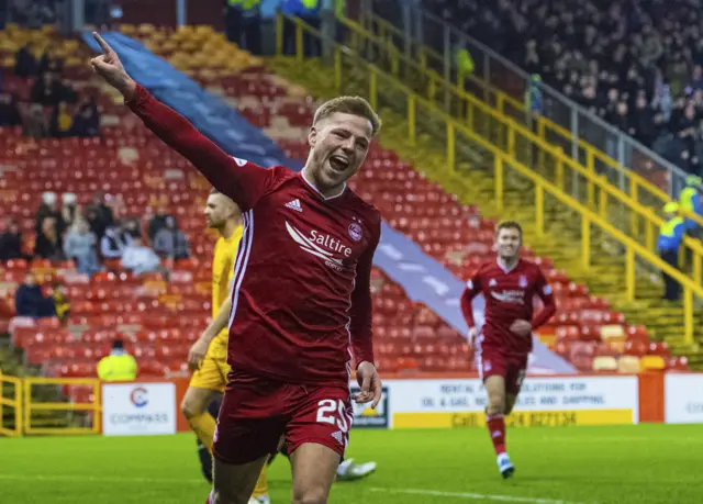 Aberdeen’s Bruce Anderson celebrates his late goal in the Dons' victory