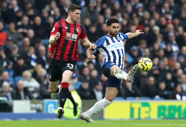 Bournemouth's Chris Mepham (left) and Brighton & Hove Albion's Alireza Jahanbakhsh battle for the ball during the Premier League match at the AMEX Stadium