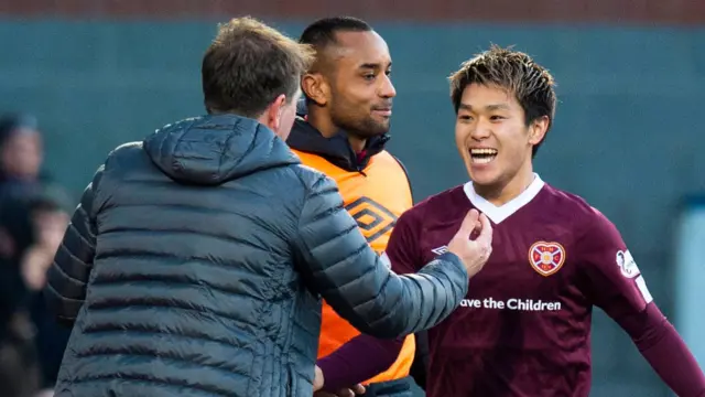 Daniel Stendel and Ryotaro Meshino celebrate