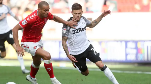 Darren Pratley (left) and Jamie Paterson (right) battle for the ball