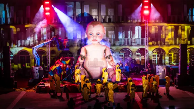 A dress rehearsal for Zara, a huge outdoor theatre production featuring a Giant baby, at the Piece Hall in Halifax, Yorkshire.