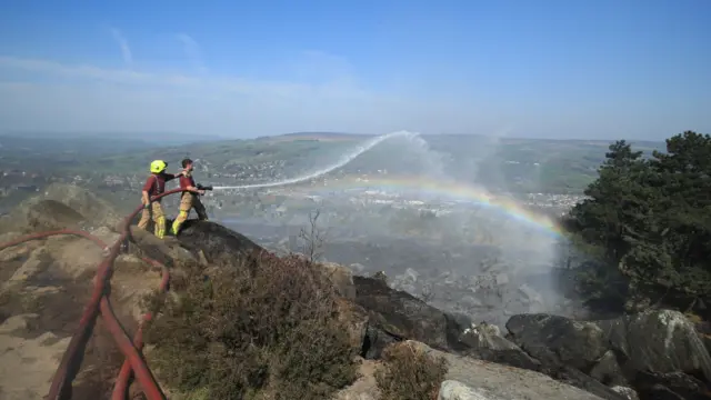 Firefighters tackle a large fire which is continuing to burn on Ilkley Moor in West Yorkshire.