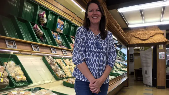 One of the volunteers inside the store when it opened in July