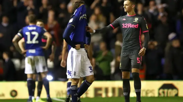 Birmingham City"s Ivan Sunjic (left) is consoled by Leeds United"s Ben White after the final whistle