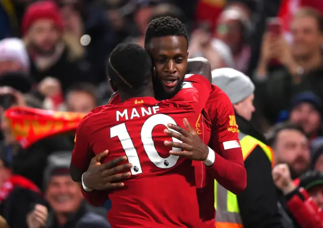 Saido Mane celebrates with Divock Origi