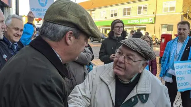 Nigel Farage and a member of the public