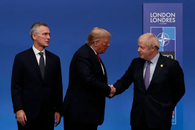 US President Donald Trump shakes hands with Prime Minister Boris Johnson