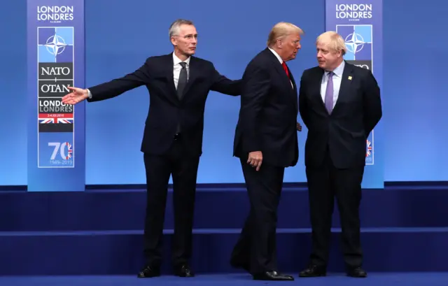 US President Donald Trump looks at Prime Minister Boris Johnson